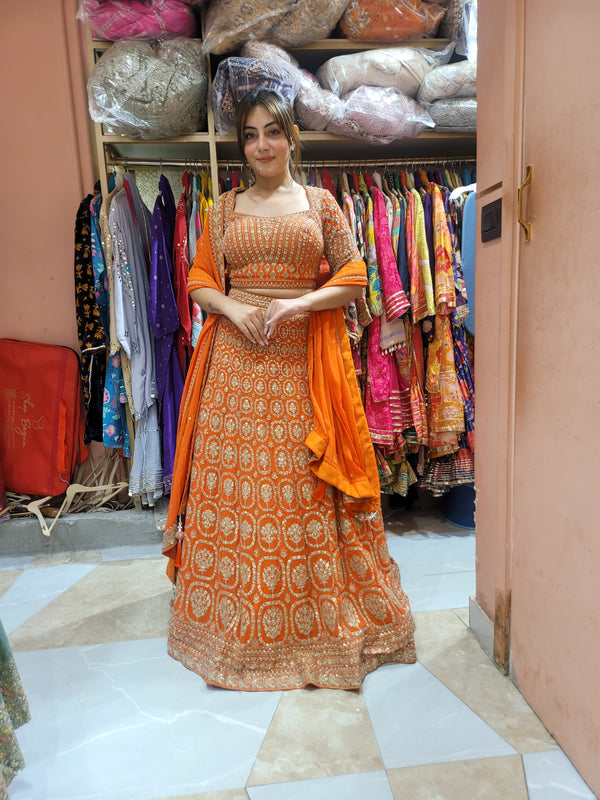 Lehnga with all over weaving, moti work and handwork on the blouse and lehnga with tassels on dupatta