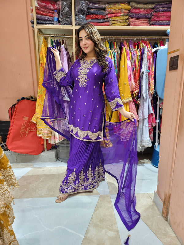 Sharara suit with all over zari work, moti work and handwork on the shirt and Sharara with beautiful net dupatta