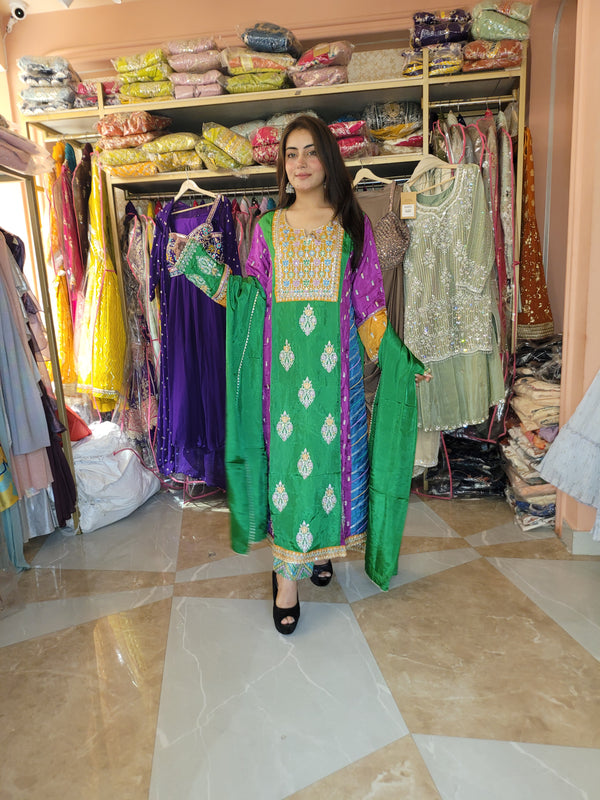 Green color suit with all over embroidery and mirror on the shirt and trouser with dupatta