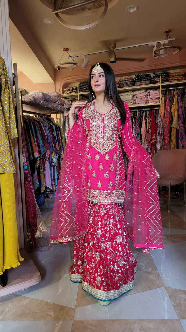 Gharara suit with all over embroidery, dabka work, gotta patti, mirror work on the shirt and gharara with lace work and moti work all over dupatta