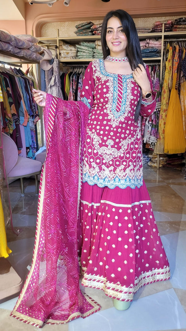 Suit with all over dabka, zari work and zardozi work on the shirt and Gharara with lace work and gotta work on net dupatta